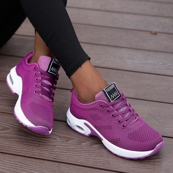 "Orthopedische dames sneakers, wit en blauw, ergonomische pasvorm voor comfort en ondersteuning bij actieve levensstijl."