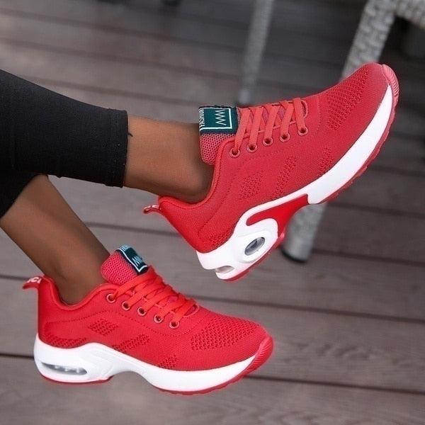 "Orthopedische dames sneakers, wit en blauw, ergonomische pasvorm voor comfort en ondersteuning bij actieve levensstijl."