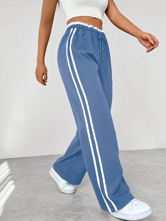 "Sportieve wide-leg broek met relaxte pasvorm en dubbele strepen, elastische tailleband, perfect voor casual stijl."