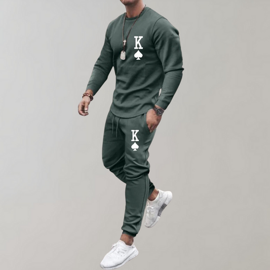 "Stijlvol en comfortabel heren trainingspak, slim-fit met ritssluiting, verkrijgbaar in groen, zwart, khaki en wit."