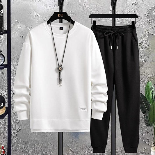 "Stijlvol joggingpak voor heren, navy met grijze accenten, comfortabele pasvorm, ideaal voor casual en thuisgebruik."