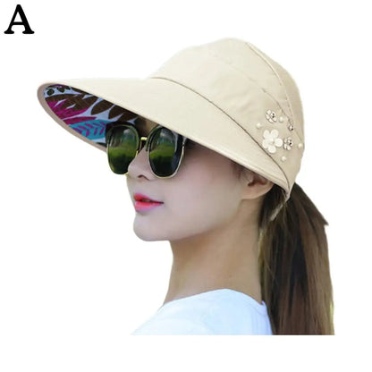 "Stijlvolle anti-UV strandhoed dames, brede rand, opvouwbaar, lichtgewicht polyester, effectieve zonbescherming."