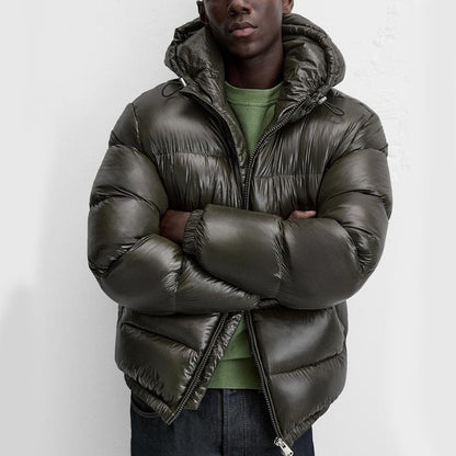 "Stijlvolle effen pufferjas voor mannen, strak minimalistisch design, comfortabele pasvorm en zijzakken, ideaal voor winterda