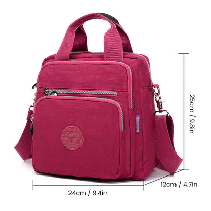 "Stijlvolle en praktische waterdichte nylon crossbody tas in zwart, met meerdere vakken en 3-weg gebruiksopties."