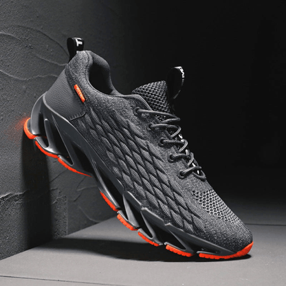 "Stijlvolle heren loopschoenen in grijs, rood, wit, zwart. Comfortabel, ademend en ideaal voor sport en dagelijks gebruik."