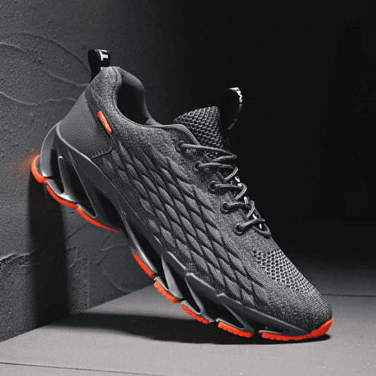 "Stijlvolle heren loopschoenen in grijs, rood, wit, zwart. Comfortabel, ademend en ideaal voor sport en dagelijks gebruik."