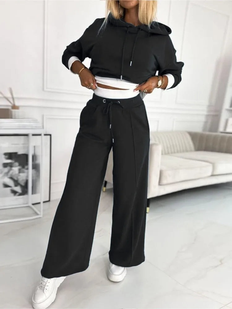 "Stijlvolle jogging loungeset vrouwen, luxe tweedelig outfit met wrap-crop hoodie en broek met brede pijpen in heather-stof."