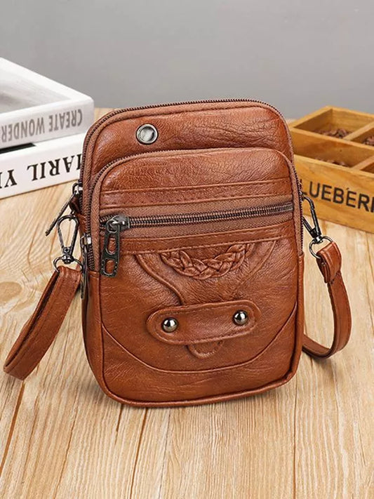"Vintage leren schoudertas Jaida met verstelbare riem en stijlvolle envelopsluiting voor dames, duurzame luxe tas"