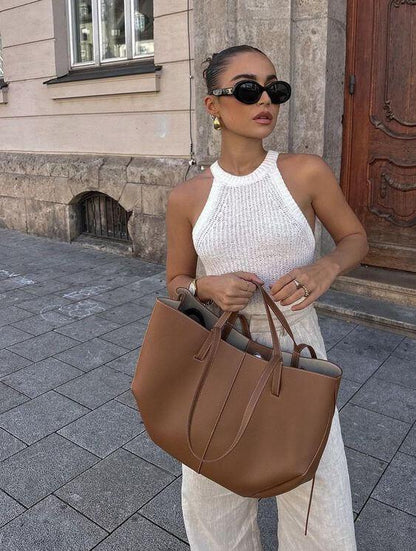 "Vintage leren tote bag voor dames met elegant design en ruime opbergruimte, perfect voor elke gelegenheid."
