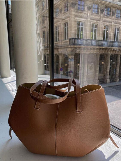 "Vintage leren tote bag voor dames met elegant design en ruime opbergruimte, perfect voor elke gelegenheid."