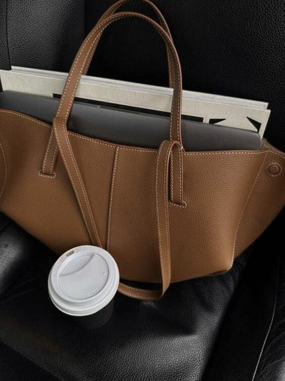 "Vintage leren tote bag voor dames met elegant design en ruime opbergruimte, perfect voor elke gelegenheid."