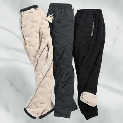 "Waterdichte en winddichte thermobroek heren met fleecevoering, grijs, voor winterse activiteiten."