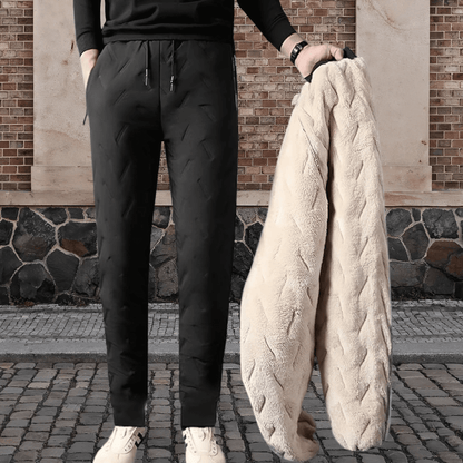 "Waterdichte en winddichte thermobroek heren met fleecevoering, grijs, voor winterse activiteiten."
