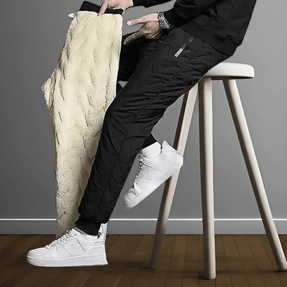 "Waterdichte en winddichte thermobroek heren met fleecevoering, grijs, voor winterse activiteiten."