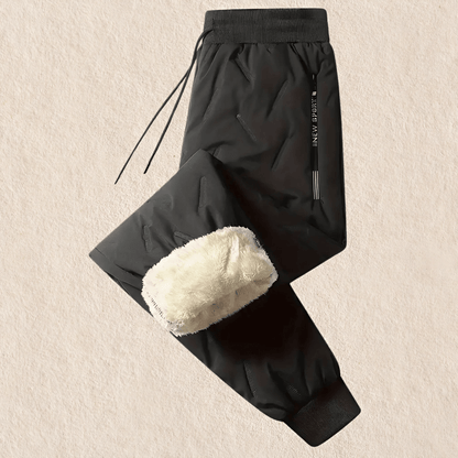 "Waterdichte en winddichte thermobroek heren met fleecevoering, grijs, voor winterse activiteiten."