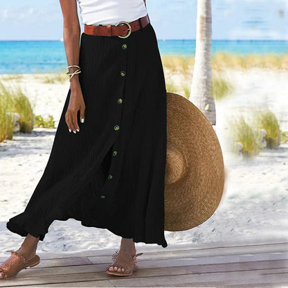 "Zomerse maxi-rok in groen; A-lijn silhouet met knoopdetails, ideale dameskleding voor warme dagen."