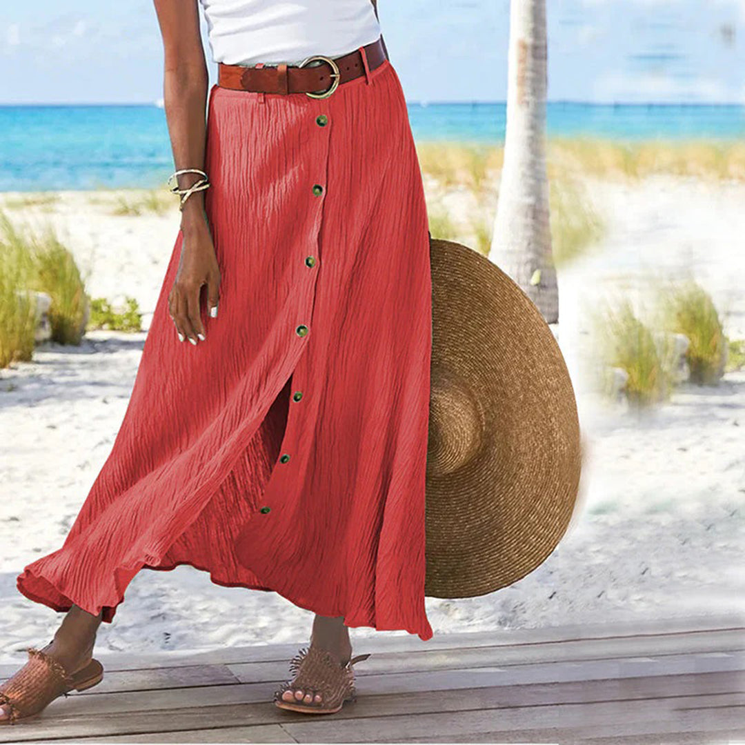 "Zomerse maxi-rok in groen; A-lijn silhouet met knoopdetails, ideale dameskleding voor warme dagen."