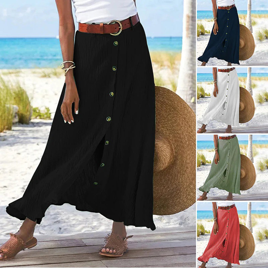 "Zomerse maxi-rok in groen; A-lijn silhouet met knoopdetails, ideale dameskleding voor warme dagen."