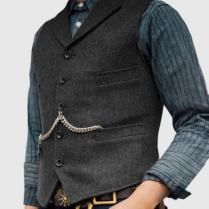 "Zwart visgraatvest voor heren, klassieke stijl met omgeslagen kraag en knoopsluiting, perfect voor lente en zomer."